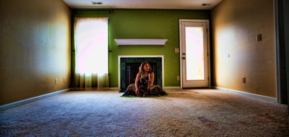 a woman sitting in an empty house_personal pics